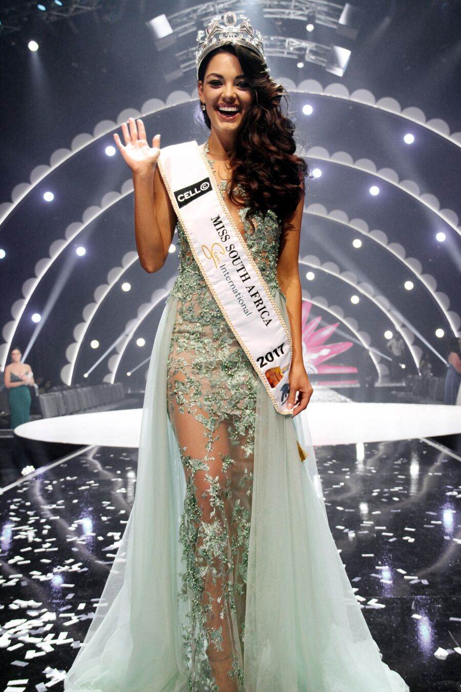 Demi-Leigh Nel-Peters waves and beams on stage in a crown and a Miss South Africa sash the night she was crowned in 2017.