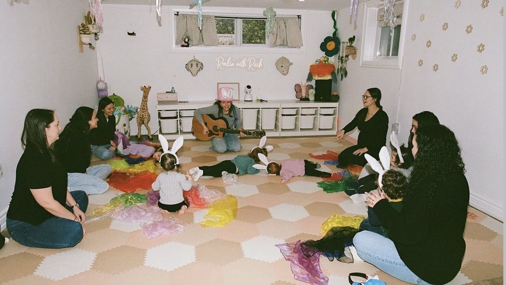 Rachel Kornblum, the children's musician known as Rockin' Rach, smiling with her young daughter.