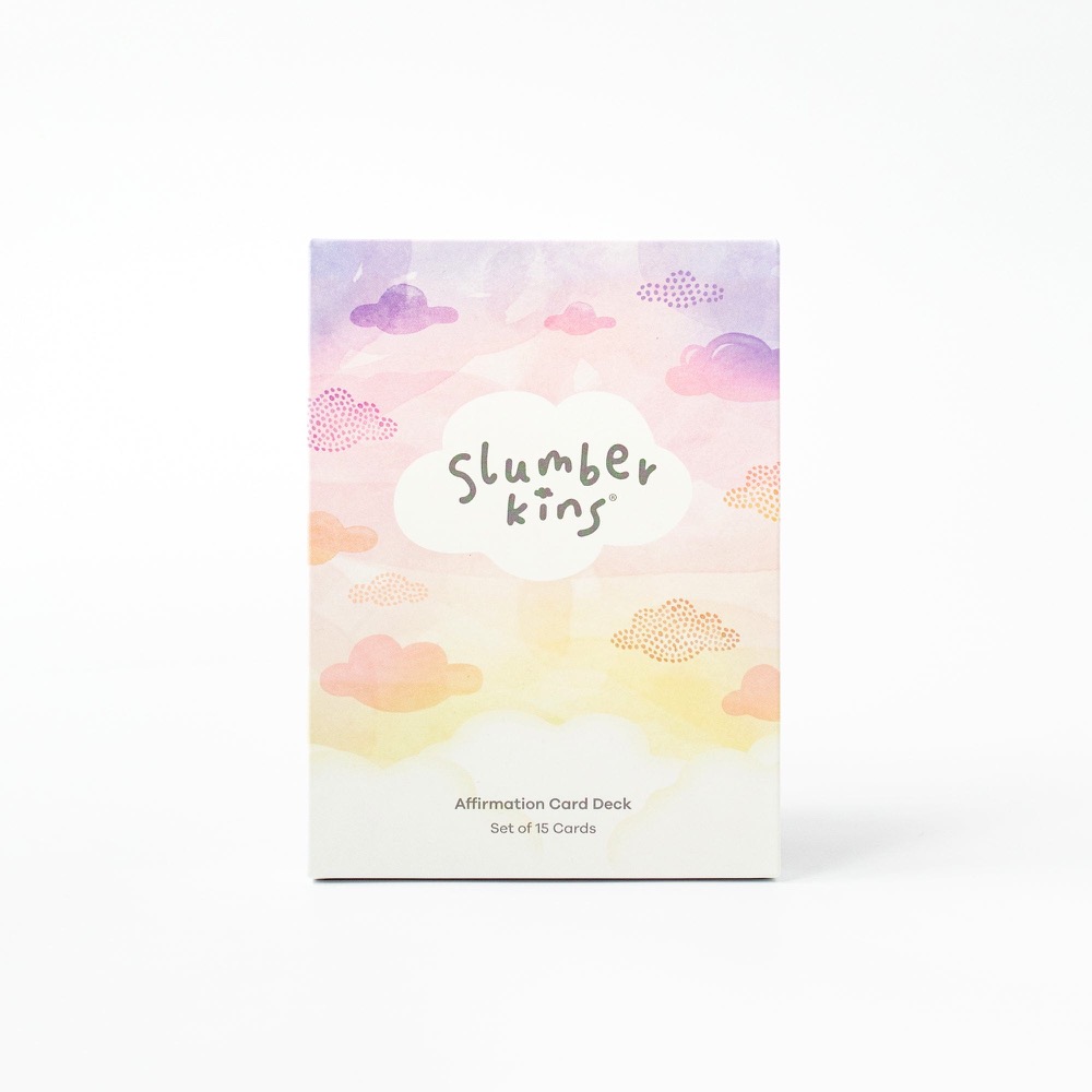 The Slumberkins Affirmation Card Deck box, a watercolour sunrise sky of pink, purple and yellow clouds with the Slumberkins cloud logo, marked Set of 15 Cards.